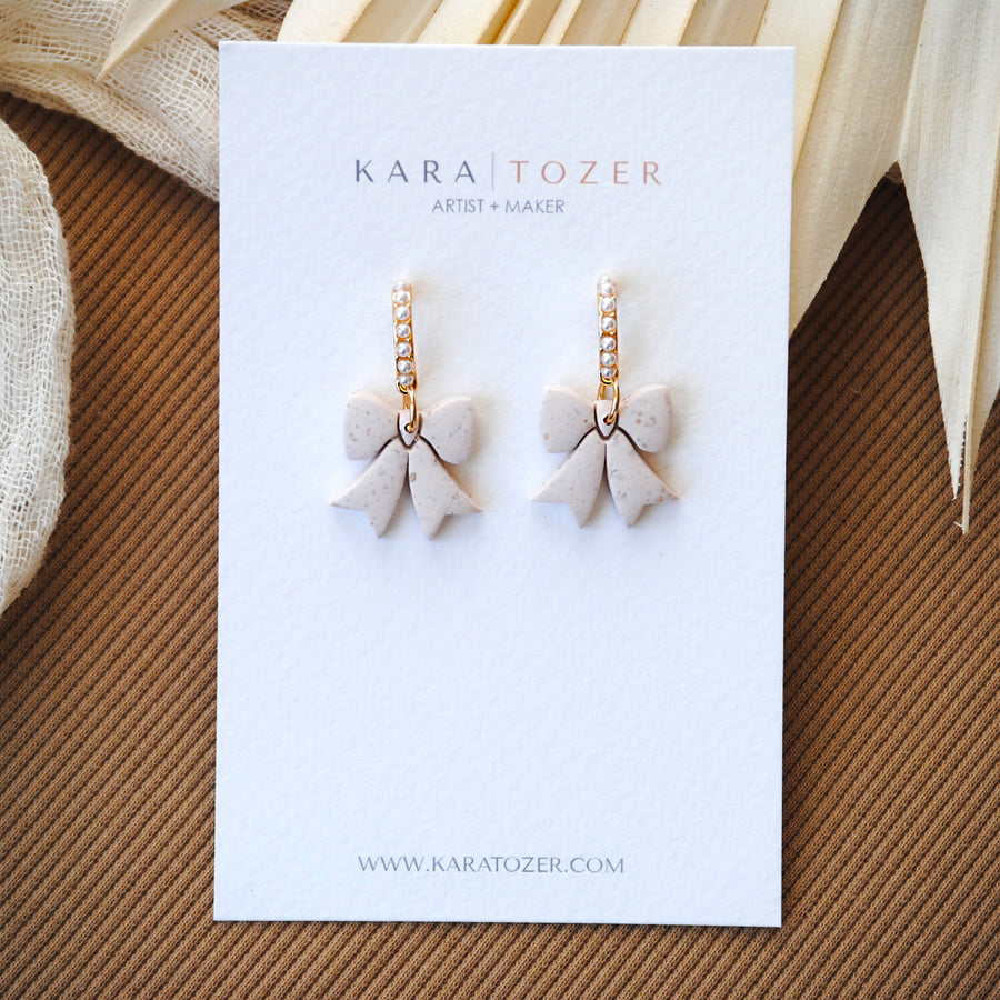 Neutral Pearl Bow Dangles