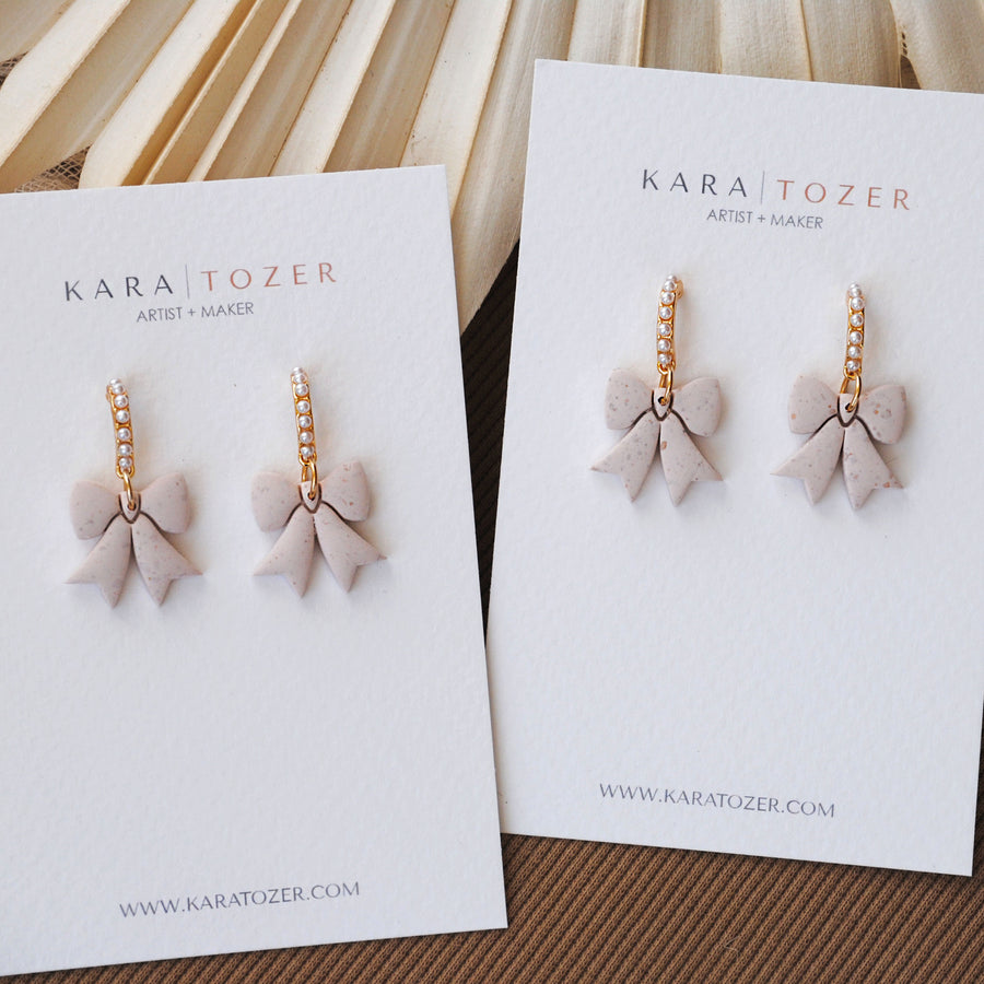 Neutral Pearl Bow Dangles