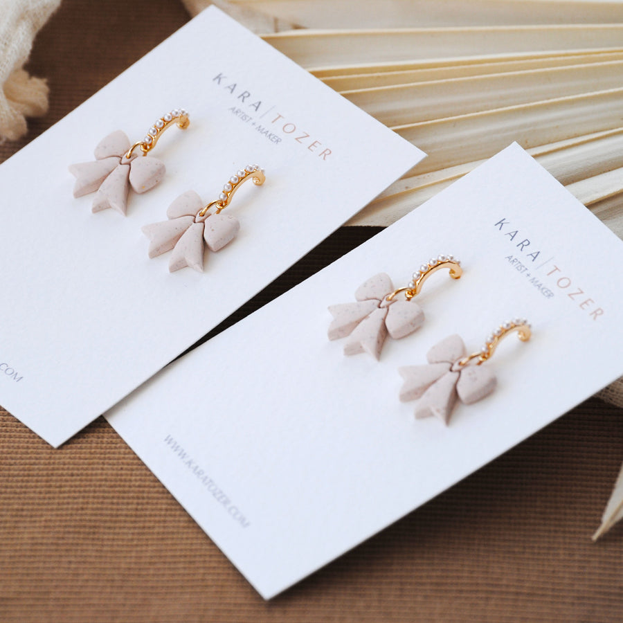 Neutral Pearl Bow Dangles