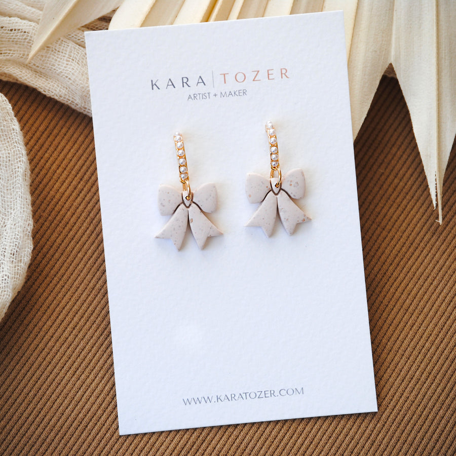 Neutral Pearl Bow Dangles